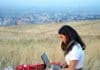 woman with laptop-plains landscape