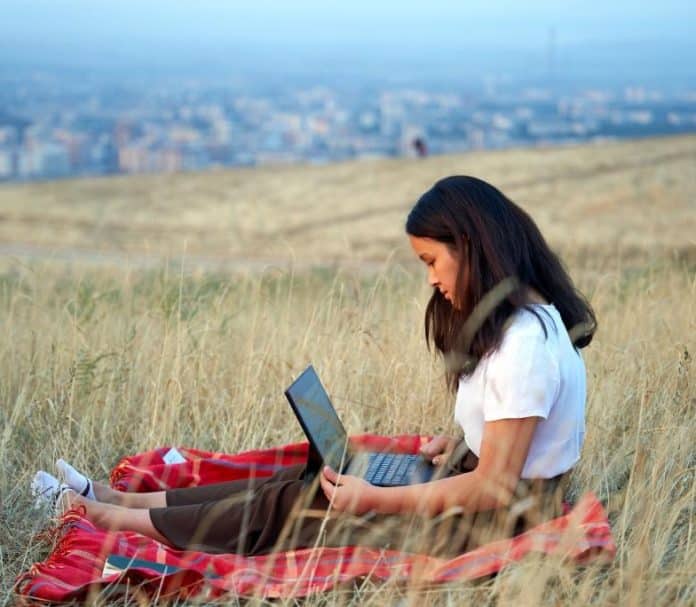 woman with laptop-plains landscape