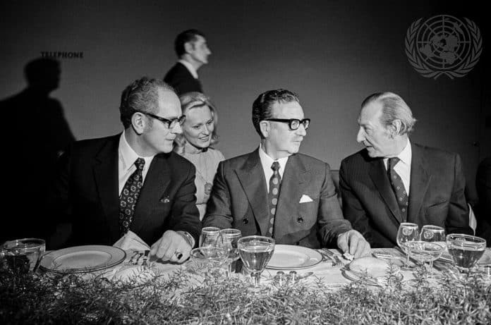 President Salvador Allende of Chile paid an official visit to United Nations Headquarters and addressed the General Assembly. He conferred with the Assembly President and the Secretary-General, met with the Heads of Latin American delegations, attended a luncheon in his honour and held a press conference. Here, President Allende is seen at the luncheon with Assembly President Stanislaw Trepczynski (Poland) and Secretary-General Kurt Waldheim. Seated behind them is Mrs. Nathalie V. Teleki, U.N. Interpreter.