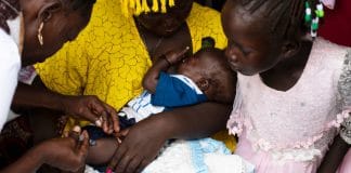 A 19-year old mother takes her three-month-old son to the Nyakuron primary health care centre in South Sudan’s capital Juba for a polio and penta vaccine. When he is old enough, she will also inoculate him against measles.