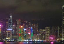 The skyline of Hong Kong harbour, seen at night.