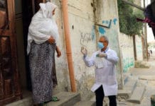 Health staff from the Shaboura Health Centre in Rafah, Gaza, run by UN relief agency UNRWA, deliver medications directly to elderly Palestine refugees in the wake of COVID-19, so reduce their chances of exposure.