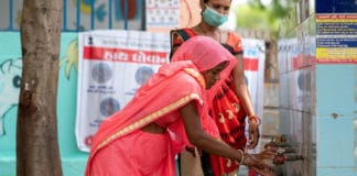 A woman in Gujarat, India, is educated on the benefits of handwashing during the COVID-19 pandemic.