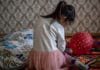 A five-year-old girl plays in her family's apartment in Kazakhstan, where UNICEF is working to eliminate domestic violence through home visits.