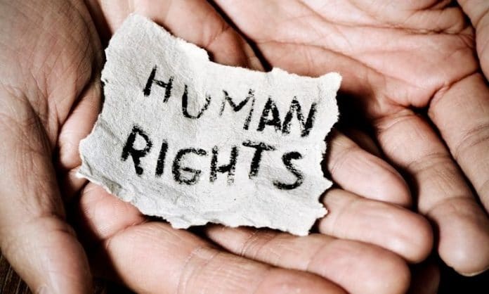 Human Rights on paper held in hands