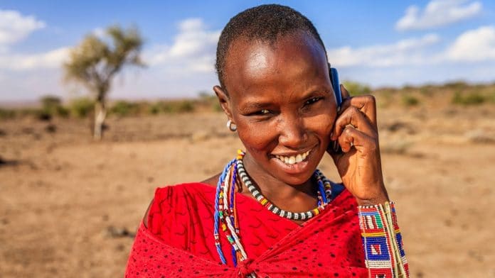 Woman from Maasai tribe using mobile phone