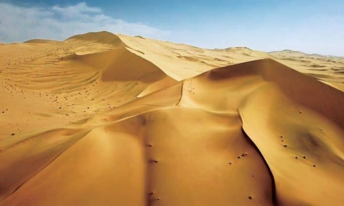 beautiful desert at Soughing Dunes (Mingshashan), a landmark on the famous Silk Road in China.