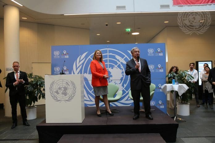 Secretary-General António Guterres (right, podium) visited UN City Copenhagen in 2019. Also present is Grete Faremo (left, podium), Under-Secretary-General and United Nations Office for Project Services Executive Director.