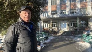 Teacher Mykhailo in the front of a secondary school in the town of Bucha, 30 km from Kyiv, Ukraine.