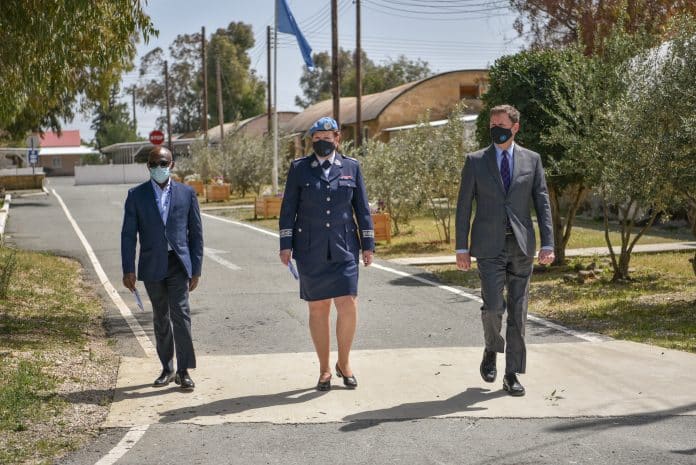 Three staff members walking in the street