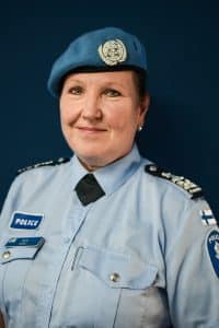 A woman in official peacekeeping police uniform