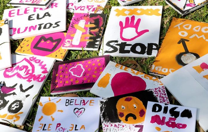 Stop violence against women display of drawings and posters