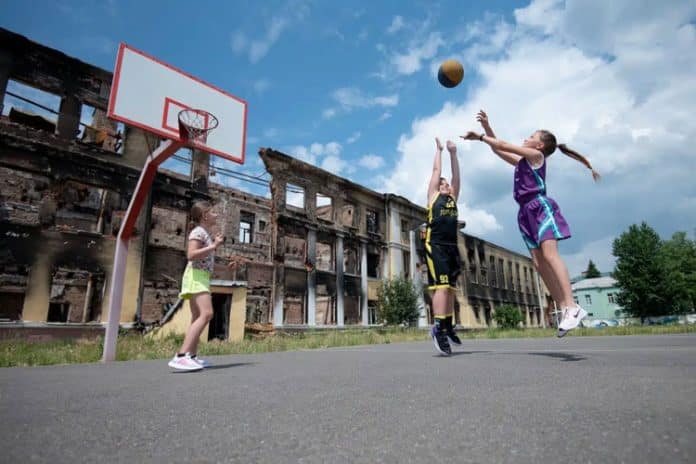 Kids play Basketball at School in Kharkiv in Ukraine.