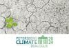 Petersberg climate dialogue logo on top of climate change image of dried lake