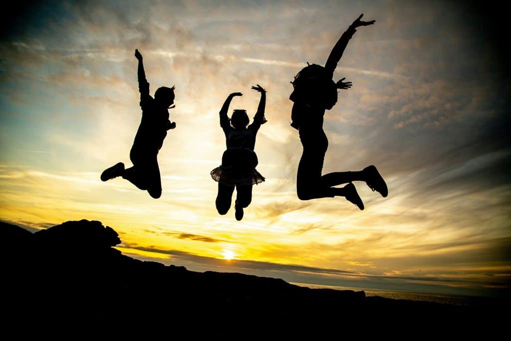 Three children jumping