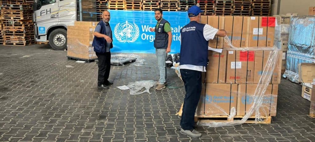 © WHO Medical supplies organized by WHO are unloaded in a warehouse in Gaza.