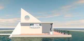 entrée du Elyx Museum, batiment blanc moderne en forme d'ile sur la mer