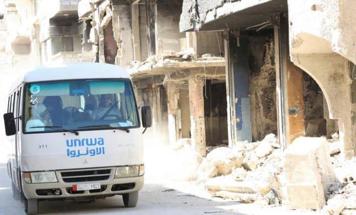 UNRWA transports Palestine refugee students from Yarmouk refugee camp to schools in neighboring areas in Damascus, Syria.