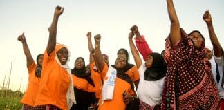 In this picture, women in Tanzania are cheering up