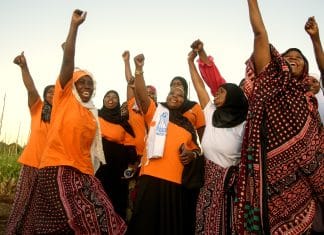 In this picture, women in Tanzania are cheering up