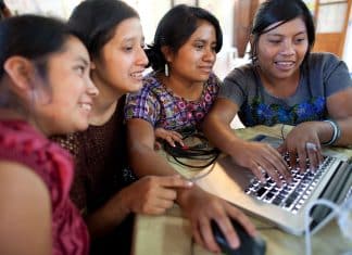 In this picture, women are using a computer