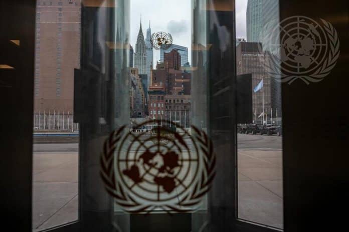 A view of the Empire State Building through the glass doors at UN Headquarters