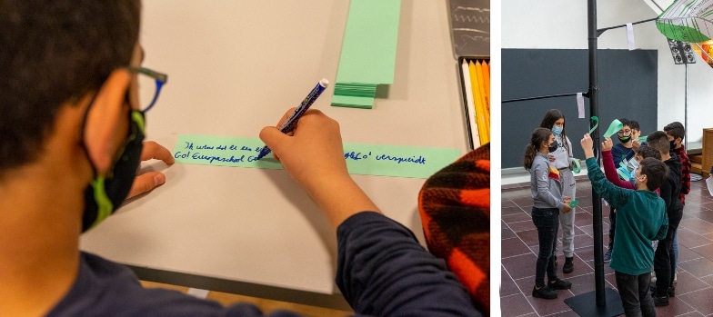 Kinderen schrijven wensen voor de wensenboom bij grootouders voor het klimaat