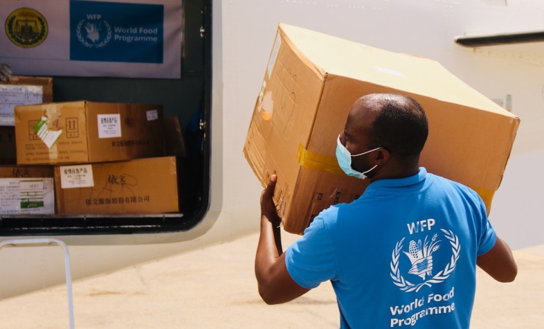 A WFP staffer loads protective equipment onto plane in Somalia-Photo-WFP-Jama Hassan