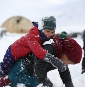 Displaced-children-play-in-the-snow-in-Afrin-Syria.