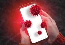 Person hands holding smartphone with dirty infectious bacteria and harmful germs on mobile smartphone display. Online hacker attack on confidential information or personal data.